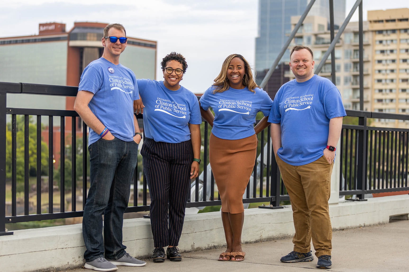 Clinton School alumni with Little Rock skyline in background